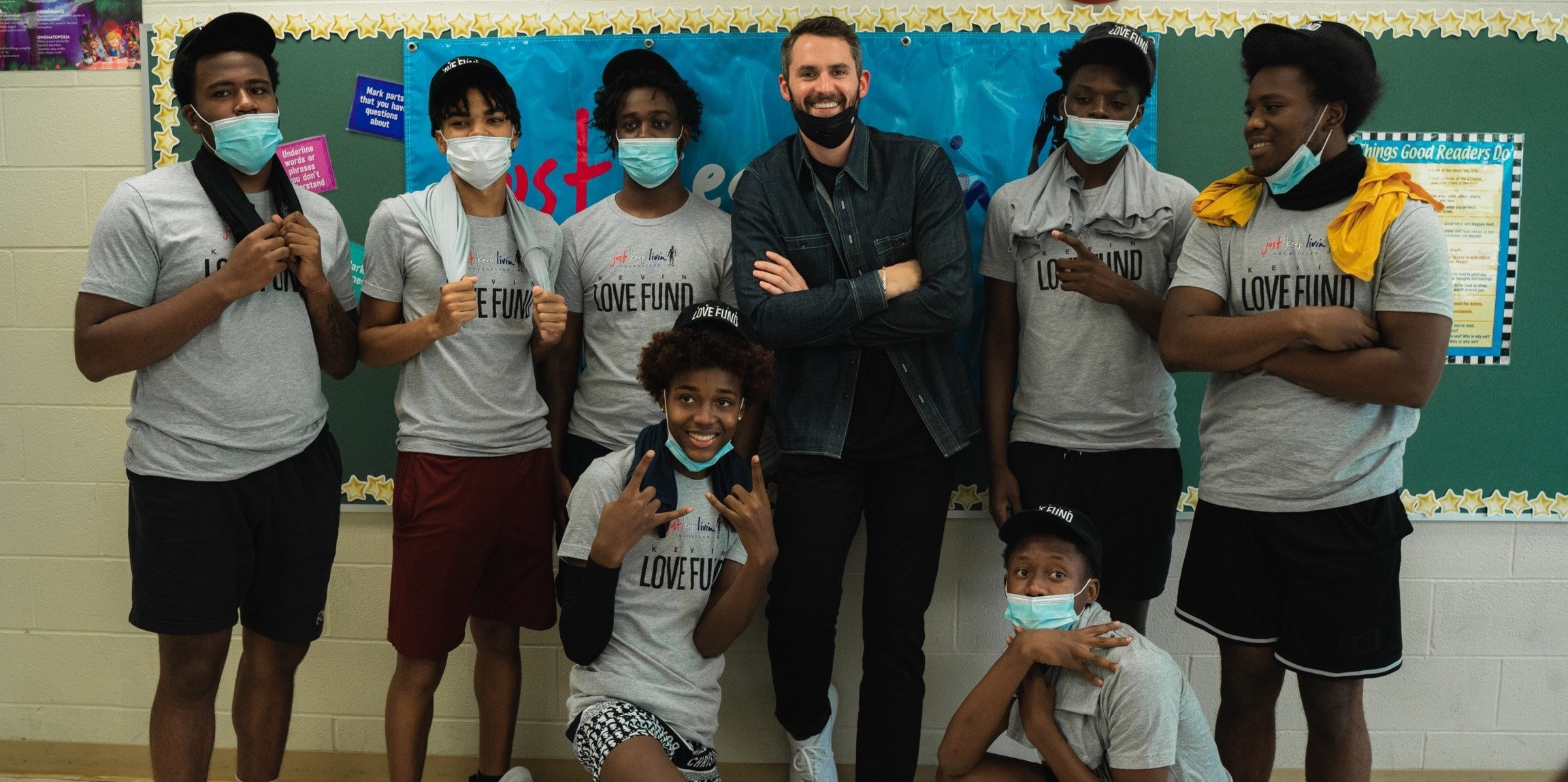 Kevin Love with students in classroom, Kevin Love Fund
